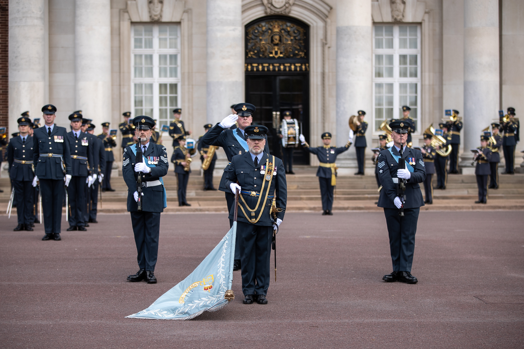 Personnel in parade with Colour Flag.